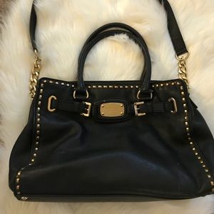 Black and gold Micheal Kors purse